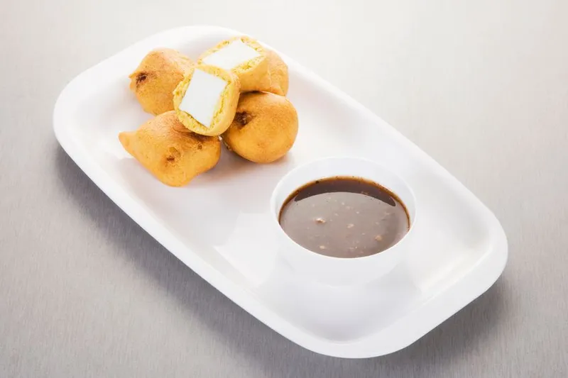 Sweet & Spicy Stuffed Paneer In Kofta Curry Recipe