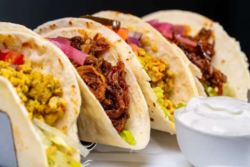 Soft Millet Taco Recipe Topped With Hummus & Veggies