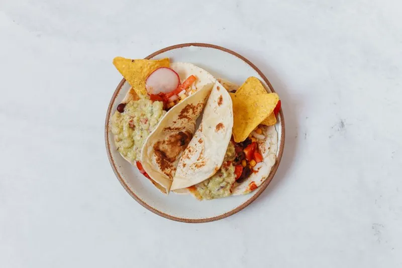 Soft Millet Taco Recipe Topped With Hummus & Veggies — photo 2