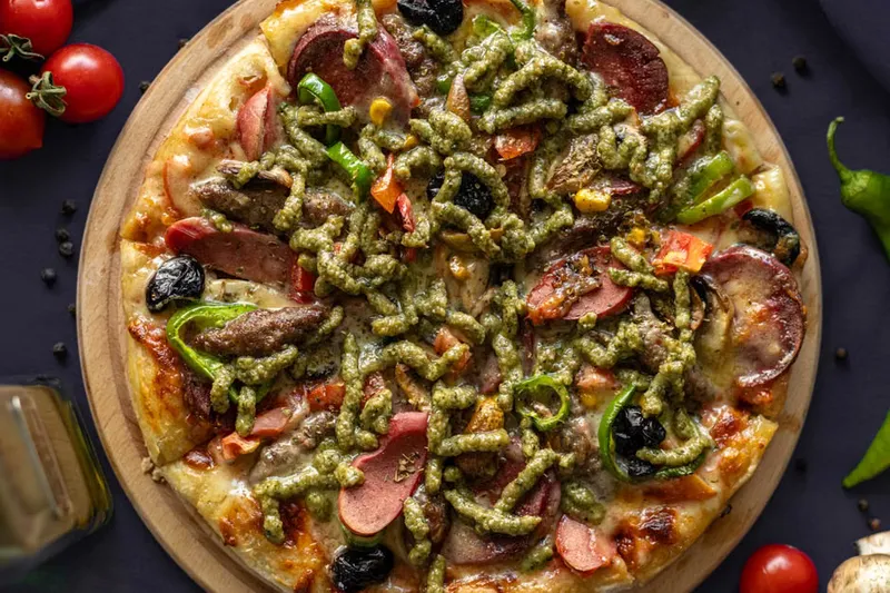 Cauliflower Crust Pizza With Pesto, Sundried Tomatoes & Goat Cheese