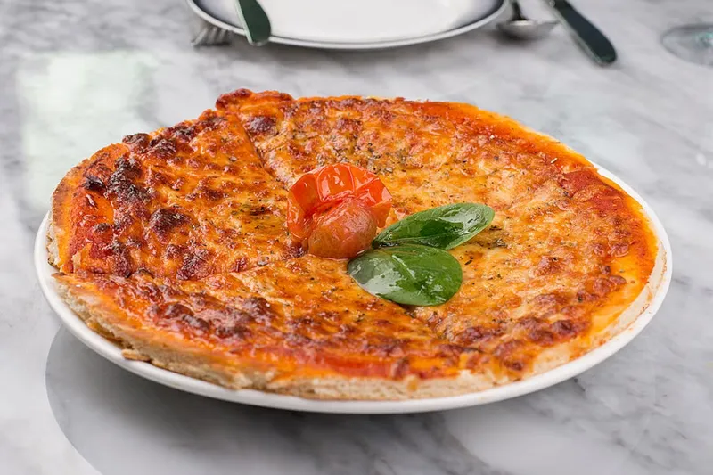 Classic Pizza Margherita Recipe - Pizza Topped With Cheese And Tomato Sauce