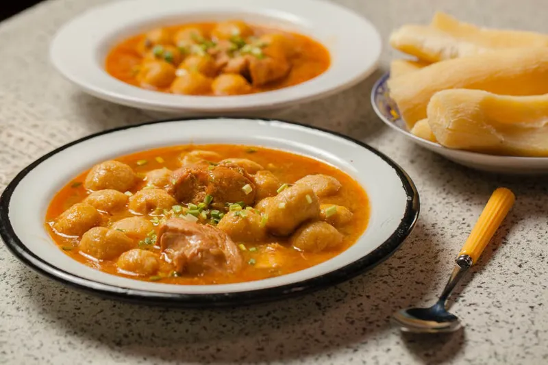 Malabar Style Kozhi Pidi Recipe - Rice Dumplings In Chicken Stew